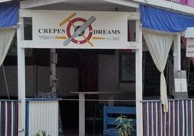 A sign that says crepes and dreams